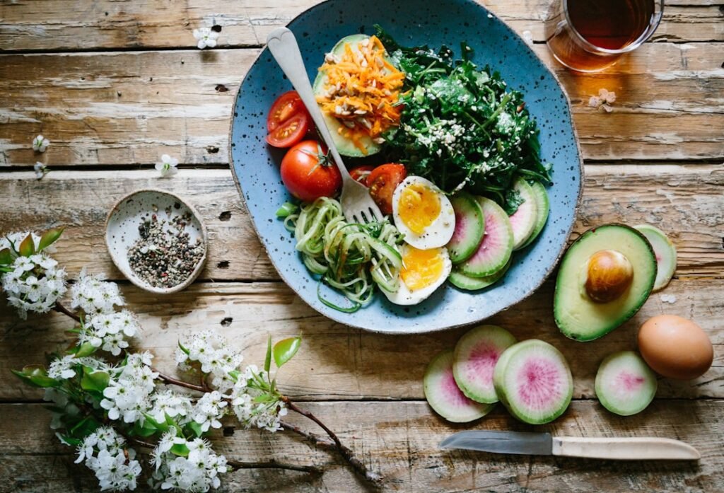 Fresh healthy vegetables and food bowls on a table
