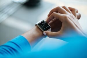 Athlete checking training data on a smartwatch