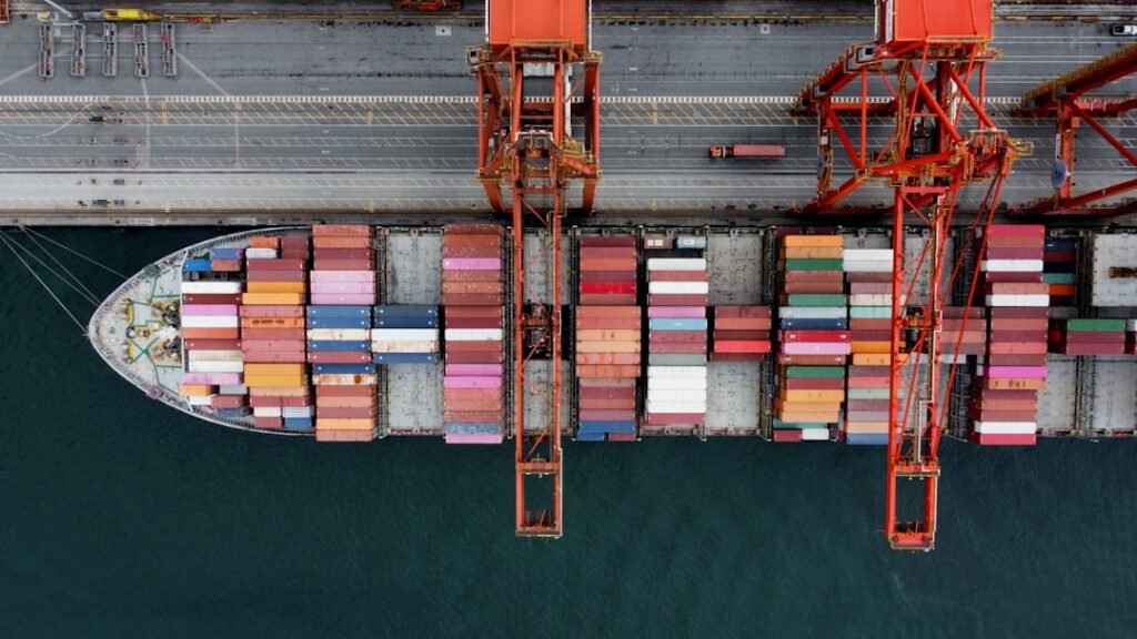 Aerial view of a container ship being unloaded at port