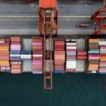 Aerial view of a container ship being unloaded at port