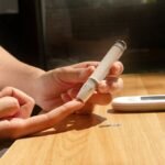 Person with medication and health tracking phone app