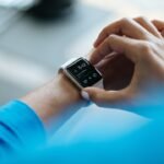 Smartwatch on wrist showing health tracking data