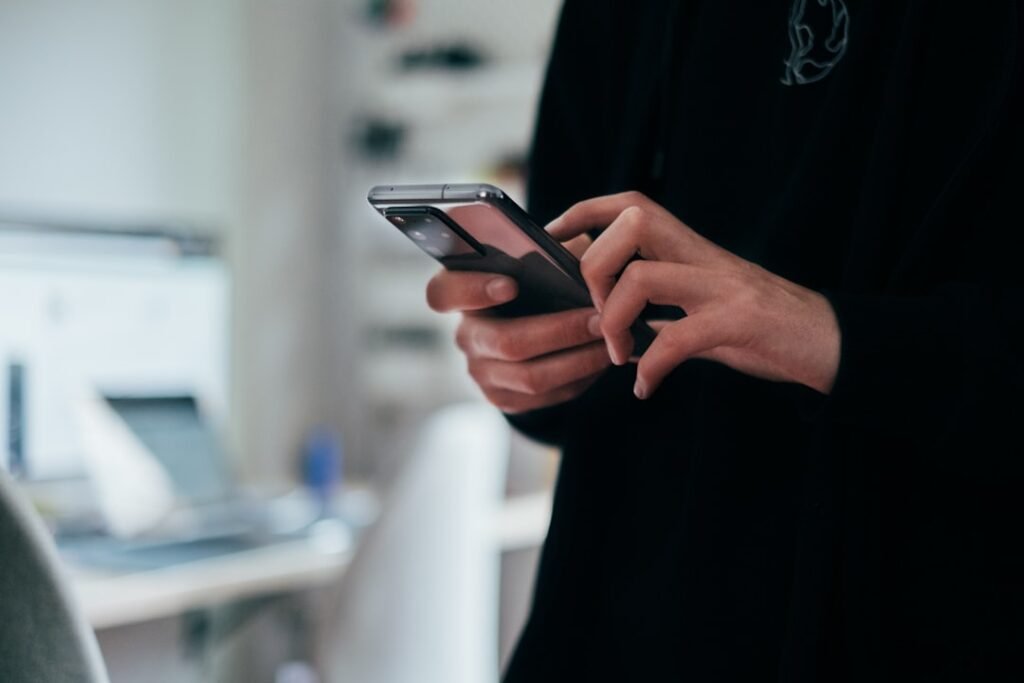 Person using an AI assistant app on a smartphone