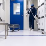 Technician working inside a semiconductor cleanroom